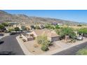 Lovely single-Gathering home featuring a low-maintenance desert landscape, tile roof, and a cozy covered patio at 3441 E Melody Dr, Phoenix, AZ 85042