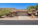 Inviting single-story home with desert landscaping, a two-car garage, and a charming entryway at 3441 E Melody Dr, Phoenix, AZ 85042