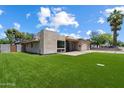 Beautifully landscaped yard with lush, green grass offering great curb appeal to this modern home at 4202 E Catalina Dr, Phoenix, AZ 85018