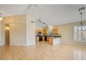 Bright living space with wood floors flowing into kitchen with granite countertops at 4327 E Desert Sky Ct, Cave Creek, AZ 85331