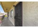 Close up on the exterior hallway leading to the front door, featuring a decorative security screen at 461 W Holmes Ave # 323, Mesa, AZ 85210