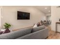 Bright living room featuring neutral colors, hardwood floors, and an open concept dining area at 461 W Holmes Ave # 323, Mesa, AZ 85210