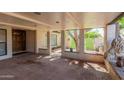 Covered front porch with brick flooring and accents, offering a shaded outdoor space at 4627 W Laurie Ln, Glendale, AZ 85302
