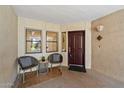 Cozy front porch with comfortable seating and unit number 114 at 5104 N 32Nd St # 114, Phoenix, AZ 85018