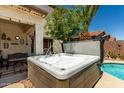 Soak and unwind in this luxurious hot tub with decorative fountains and lush greenery surroundings at 861 E Indian Wells Pl, Chandler, AZ 85249