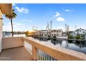 Scenic waterfront view from the balcony of a home on the water under a sunny, clear blue sky at 1414 W Coral Reef Dr, Gilbert, AZ 85233