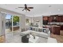 Stylish living room showcasing an open floor plan with a lake view, modern furnishings, and ample natural light at 1414 W Coral Reef Dr, Gilbert, AZ 85233
