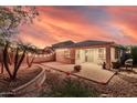 Cozy backyard featuring a paved patio with outdoor seating and lighting at 1783 W Cool Water Way, San Tan Valley, AZ 85144