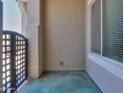 Private courtyard with an ornamental gate and covered patio area at 19969 N Santa Cruz Dr, Maricopa, AZ 85138
