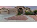 Inviting single-story home with a terracotta roof, arched entry, and low-maintenance desert landscaping at 2058 E Marlene Dr, Gilbert, AZ 85296