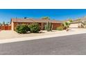 Single story home with tidy desert landscaping and mountain views beyond the property at 2437 E North Ln, Phoenix, AZ 85028
