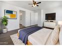 Tranquil main bedroom features a modern decor, ensuite bathroom and plenty of natural light at 297 W Tamarack Dr, San Tan Valley, AZ 85140