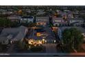 Expansive aerial view showcasing the property's tiled roof, solar panels, landscaped yard, and neighborhood setting at 3049 E Longhorn Dr, Gilbert, AZ 85297