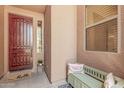 Inviting front porch with a stylish front door, a cozy bench, and a 'hello' welcome mat at 3622 E Sparrow Pl, Chandler, AZ 85286