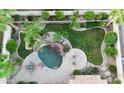 Aerial view of a backyard oasis with a pool, lush landscaping, patio, and plenty of room for entertaining at 3622 E Sparrow Pl, Chandler, AZ 85286