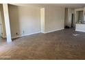 Open-concept living area with tile flooring, neutral paint, and access to other areas of the home at 4523 E Gleneagle Dr, Chandler, AZ 85249