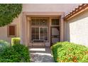 Inviting covered front porch featuring a bench and colorful landscaping at 6758 W Quail Ave, Glendale, AZ 85308