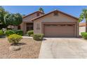 Exterior of single story home, showing two car garage and desert landscaping at 6758 W Quail Ave, Glendale, AZ 85308