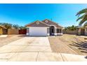 Charming single-story home features a well-manicured lawn and attached two-car garage at 723 N Joshua Tree Ln, Gilbert, AZ 85234