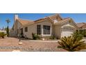 A well-maintained house featuring desert landscaping, adding curb appeal and charm to the property at 7603 W Oraibi Dr, Glendale, AZ 85308