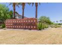 Fulton Homes Estrella Commons brick signage welcomes residents and guests to the neighborhood at 15276 W Latham St, Goodyear, AZ 85338