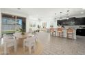 Open-concept living space, seamlessly blending the kitchen, dining, and living areas, with lots of natural light at 17652 W Fetlock Trl, Surprise, AZ 85387