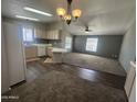 Open floor plan showing kitchen and living room combination with natural light at 18026 N Cave Creek Rd # 140, Phoenix, AZ 85032