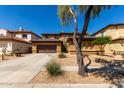Charming two-story home boasts a spacious front yard, a two-car garage, and a cozy front porch at 2030 W Whisper Rock Trl, Phoenix, AZ 85085