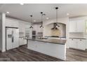 Bright kitchen with white cabinets, granite counters, subway tile backsplash and stainless appliances at 4167 E Sierra Madre Ave, Gilbert, AZ 85296