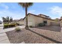 Well-maintained single-Gathering home featuring a two-car garage, desert landscaping, and a mature palm tree at 4182 W Park Ave, Chandler, AZ 85226