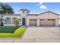 Beautiful single-story home with desert landscaping, three-car garage and unique turret design at 4206 E Blue Ridge Pl, Chandler, AZ 85249