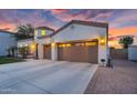 Beautifully designed home with a three-car garage, desert landscaping and an arched entryway at 4206 E Blue Ridge Pl, Chandler, AZ 85249