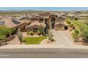 An attractive home with manicured front lawn and landscaping in a peaceful desert community at 4418 W Yoosooni Dr, New River, AZ 85087