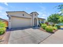 Charming home features a well-kept yard and attached two-car garage, with a nice driveway at 5637 S Parrish --, Mesa, AZ 85212