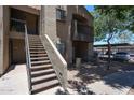 Exterior of apartment building with stairs and covered parking in the background at 747 S Extension Rd # 115, Mesa, AZ 85210