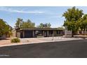 Attractive single-story home with desert landscaping and a modern gray color scheme at 7620 N 12Th Pl, Phoenix, AZ 85020