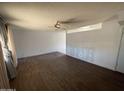 Spacious living room features a ceiling fan and a partial view of the other room at 8114 E Jackrabbit Rd, Scottsdale, AZ 85250
