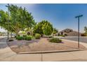 Charming street view showing multiple houses with well maintained lawns and desert landscaping, located on Baylor Ln at 91 W Baylor Ln, Gilbert, AZ 85233