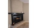 Close up view of the fireplace with a tiled hearth and decorative mantel at 1401 E Puget Ave # 24, Phoenix, AZ 85020