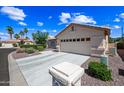 Lovely single-Gathering home with a well-kept lawn and a spacious driveway leading to the garage at 15194 W Vale Dr, Goodyear, AZ 85395