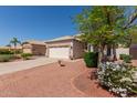 Charming single-story home featuring desert landscaping and a well-manicured yard at 20632 N 103Rd Ave, Peoria, AZ 85382