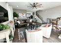 Spacious living room with a ceiling fan and staircase to the upper level at 2090 S Dorsey Ln # 1019, Tempe, AZ 85282