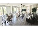 Bright and airy living room with large windows, hardwood floors and a ceiling fan at 2090 S Dorsey Ln # 1019, Tempe, AZ 85282