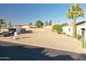 Clear view of vacant lot, bordered by block wall, with surrounding desert landscaping and neighborhood homes at 2249 N Shannon Way, Mesa, AZ 85215