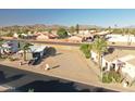 Aerial shot of a vacant lot with mountain views, showcasing the surrounding neighborhood and desert landscape at 2249 N Shannon Way, Mesa, AZ 85215