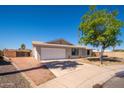 Charming single story home featuring a two car garage and a well maintained front yard at 3307 W Mescal St, Phoenix, AZ 85029