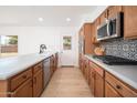 Modern kitchen featuring updated cabinets, a spacious island, and stainless steel appliances at 3307 W Mescal St, Phoenix, AZ 85029