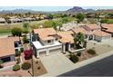 Aerial view of a home boasting desert landscaping, a tile roof, and proximity to a golf course at 4002 N San Gabriel Cir, Mesa, AZ 85215