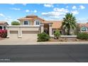 Charming two-story home featuring a tile roof, desert landscaping, and a spacious three-car garage at 4002 N San Gabriel Cir, Mesa, AZ 85215