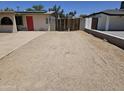Spacious driveway and yard area providing ample parking and outdoor space in this home at 4110 E Wagoner Rd, Phoenix, AZ 85032